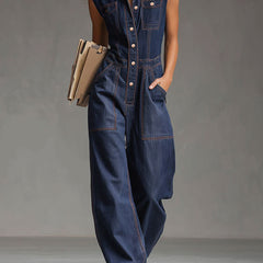 Dark blue denim women's sleeveless balloon jumpsuit with multiple pockets and wide-leg pants, featuring a relaxed fit and casual style.