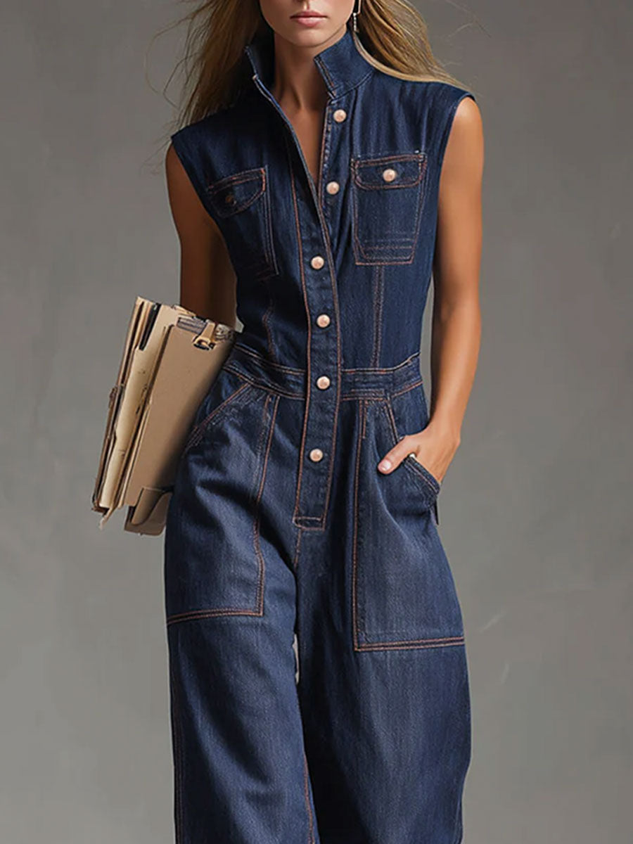 Dark blue denim sleeveless balloon jumpsuit with multiple pockets, designed for women, featuring a relaxed fit and stylish details.