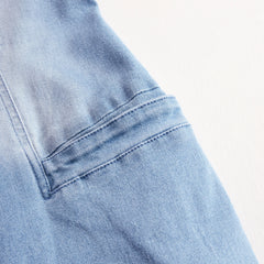 Light blue denim sleeveless raw edge wide-leg jumpsuit for women, featuring a stylish and relaxed fit.