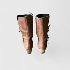Orthopedic women's boots with classic arch support in neutral tones, designed for comfort and foot health.
