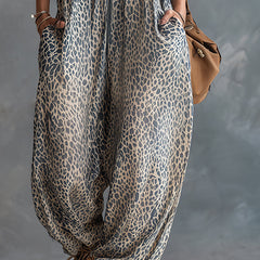 Apricot leopard print hooded chiffon jumpsuit for women, stylish and lightweight pants with a relaxed fit.