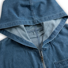 Casual women's denim jumpsuit with long sleeves, hood, zipper, and retro pocket design, perfect for relaxed everyday wear.