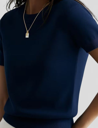 Women's knit top made from wool blend, featuring a comfortable classic fit, perfect for casual and stylish wear.