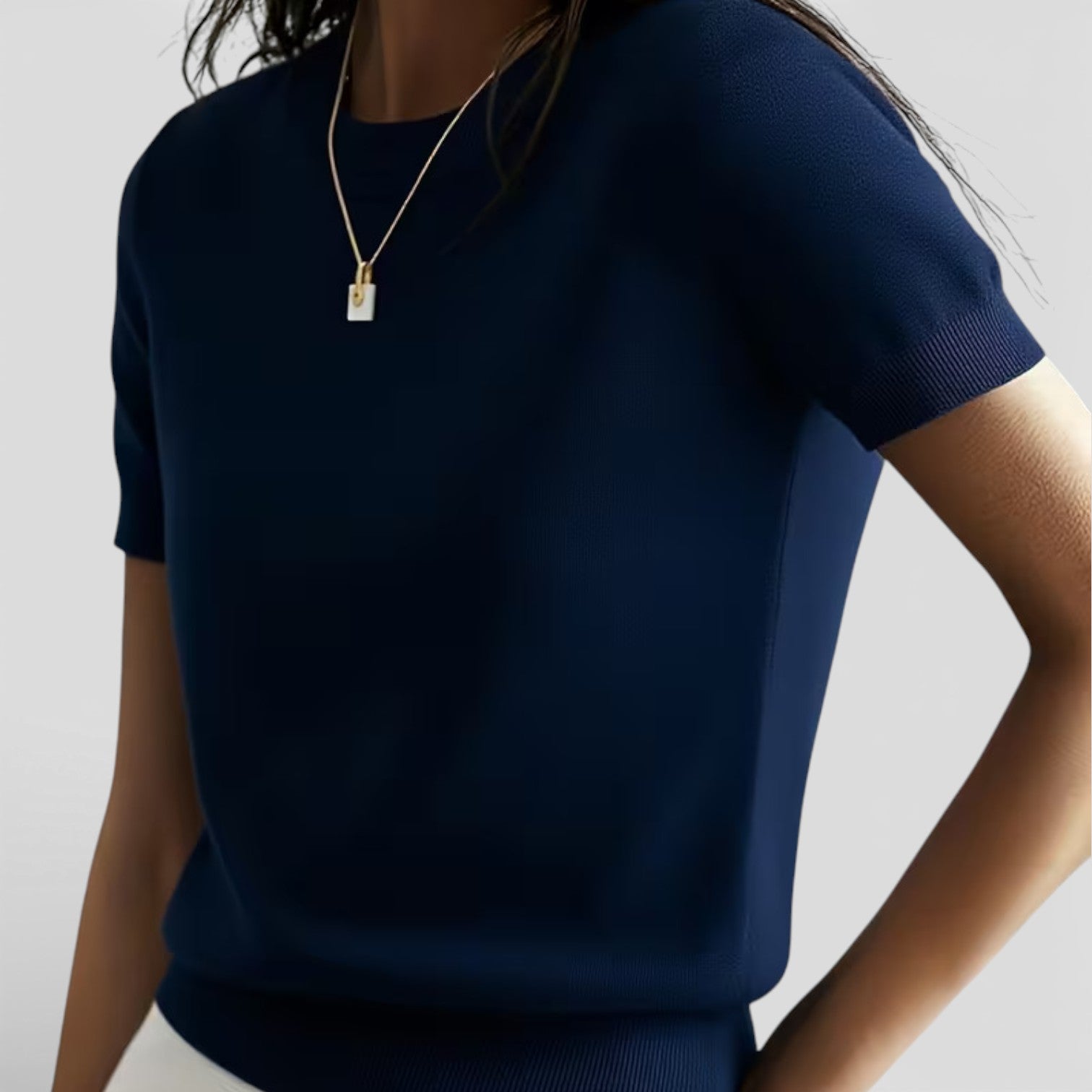 Women's knit top made from wool blend, featuring a comfortable classic fit, perfect for casual and stylish wear.
