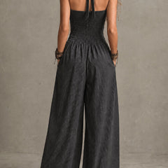 Charcoal pinstripe halter neck wide-leg jumpsuit for women, featuring stylish pants from My Store, displayed on a hanger.