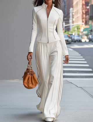 White stand collar zip-up wide-leg women's trouser suit with tailored pants and matching top, stylish and modern ensemble.