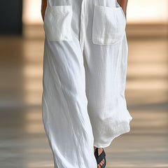 White linen sleeveless wide-leg jumpsuit for women, stylish and comfortable, featuring a relaxed fit and modern design.