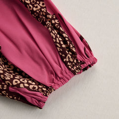 Rose red leopard print chiffon jumpsuit with long sleeves for women, featuring a stylish and flowing design.