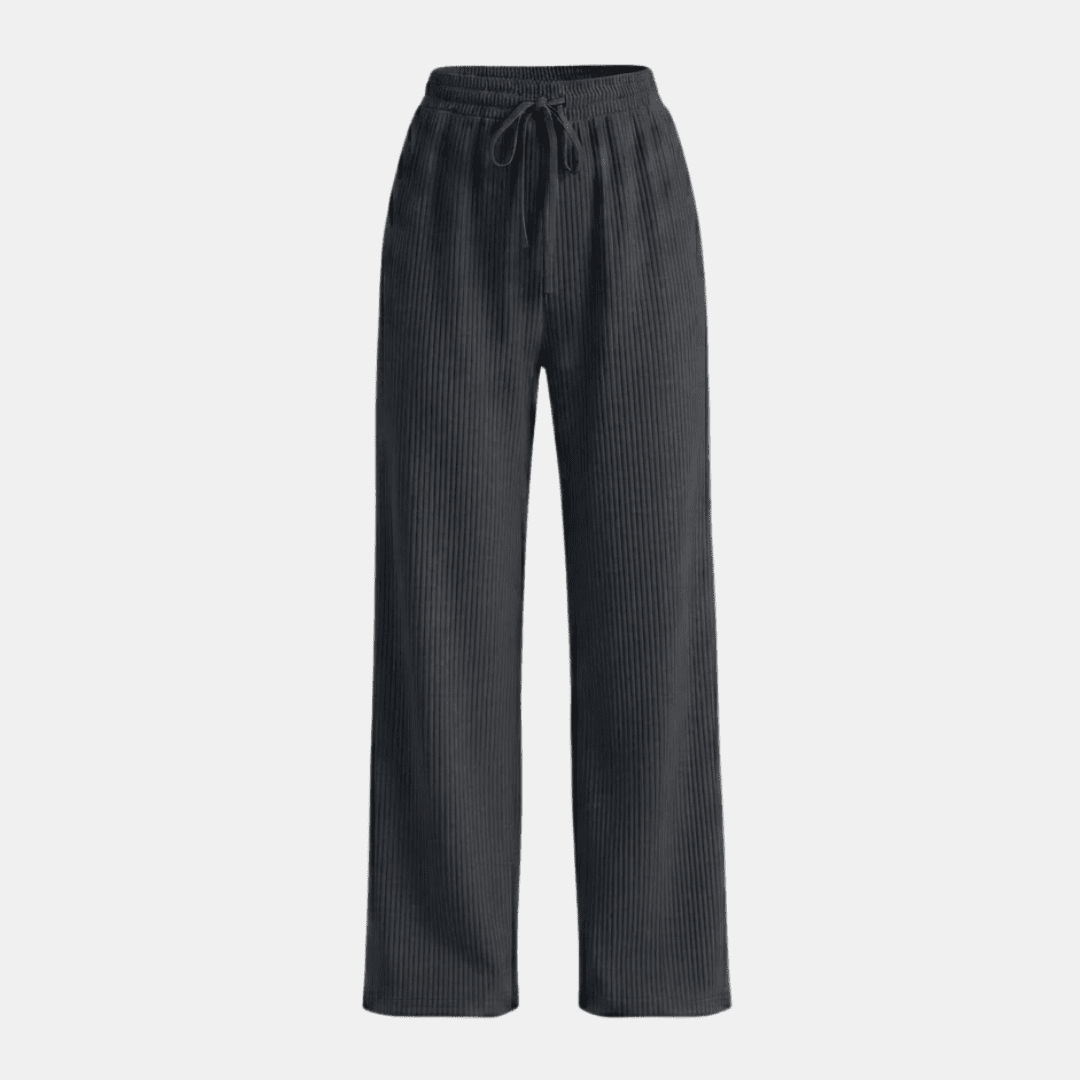 Women's plissé wide-leg trousers by Tammy Bradley, showing the flowing fabric and relaxed fit of the stylish pants.