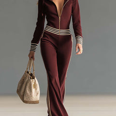 Dark blue knitted women's hooded zip-up v-neck jumpsuit, stylish and comfortable pants with a hood and front zipper detail.