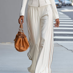 White stand collar zip-up wide-leg women's trouser suit with tailored pants and matching top, stylish and modern.