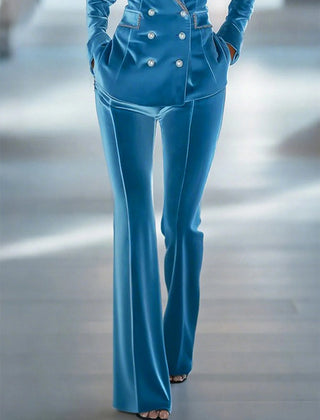Blue loose velvet flared women's trousers with wide legs and high waist, stylish pants for women.