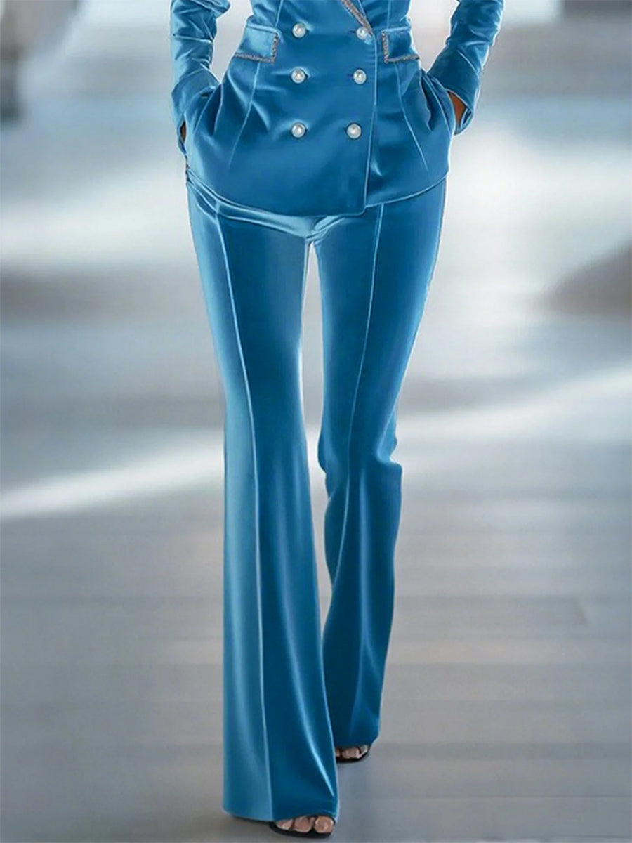 Blue loose velvet flared women's trousers with wide legs and high waist, stylish pants for women.
