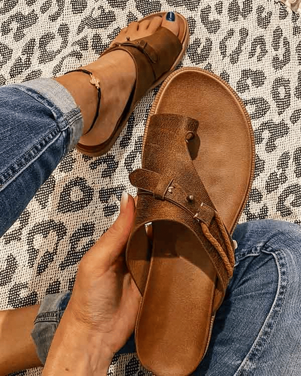 Open-toe women's orthopedic sandals with a heel, stylishly designed for comfort and support, featuring a sleek strap and cushioned sole.