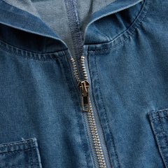 Women’s casual loose retro denim jumpsuit with long sleeves, hood, zipper, and pockets, featuring a relaxed fit and stylish design.