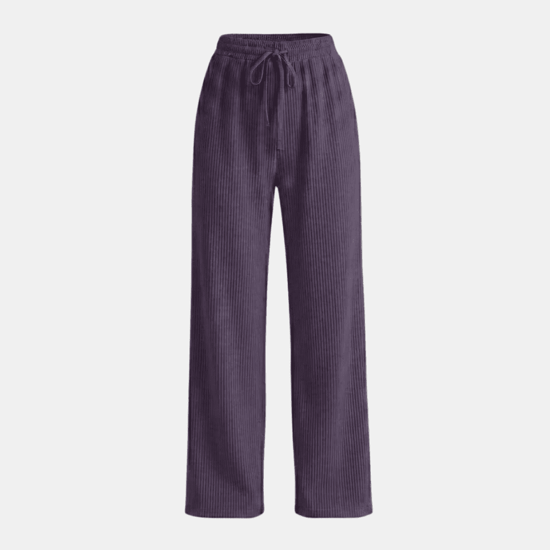 Women's plissé wide-leg trousers by Tammy Bradley, showcasing flowy fabric and relaxed fit in a stylish pants silhouette.
