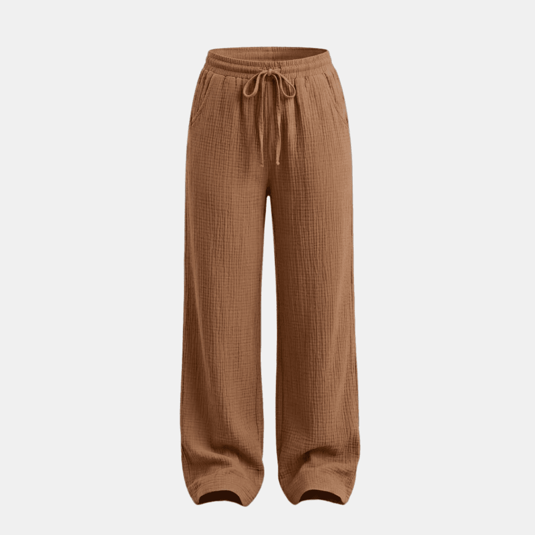 Women's cotton wide-leg trousers by Tammy Bradley, showing the relaxed fit and comfortable fabric in a natural pose.
