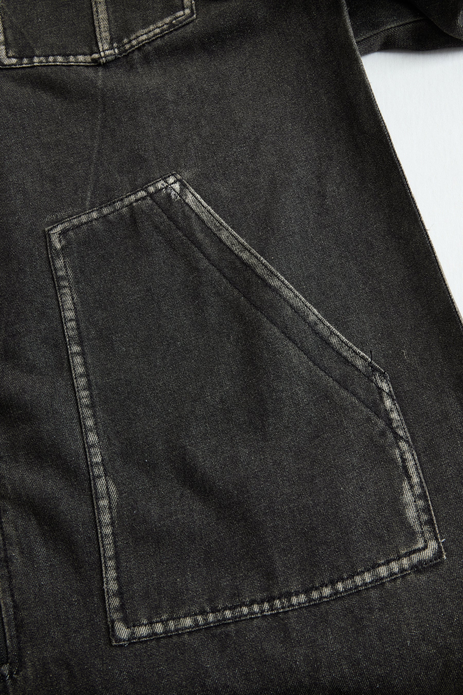 Women's casual loose retro denim jumpsuit with hood, zipper front, long sleeves, and pocket details.