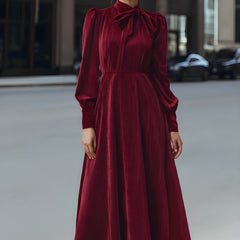 Burgundy velvet pleated bow-neck midi dress, elegant cocktail dress with a fitted waist and flowing skirt.