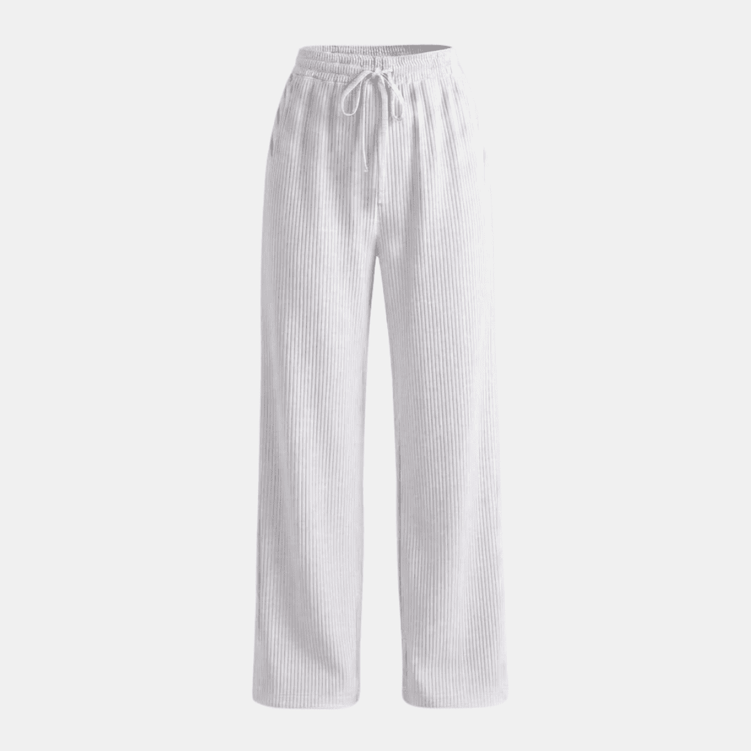 Women's plissé wide-leg trousers by Tammy Bradley, flowing fabric, high waist, and relaxed fit for stylish comfort.