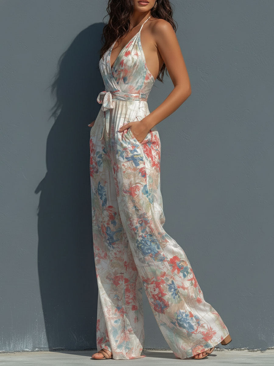 White floral satin halter neck jumpsuit for women with wrap front and wide-leg pants, stylish and elegant design.