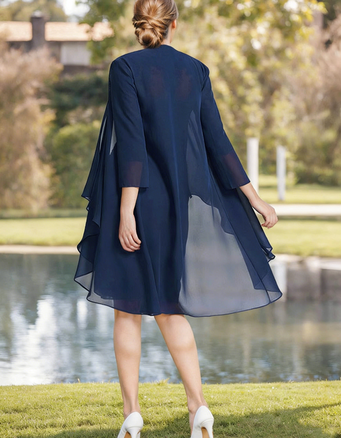 Navy blue tulle midi dress for women, pleated two-piece set with a flowing skirt and fitted top, elegant and stylish.