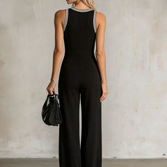 Black color-block V-neck sleeveless jumpsuit with button-down front, designed for women, featuring a stylish and modern pants look.