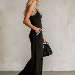 Black color-block V-neck sleeveless jumpsuit for women, featuring button-down front and stylish pant design.