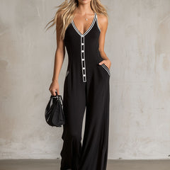 Black color-block V-neck button-down sleeveless jumpsuit for women, featuring stylish design and tailored fit.