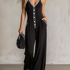 Black color-block sleeveless V-neck button-down jumpsuit for women, featuring stylish pants design and modern silhouette.
