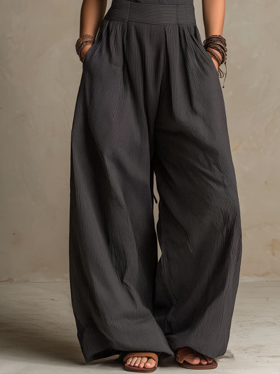 Charcoal pinstripe halter neck wide-leg jumpsuit for women, stylish pants by My Store, featuring a halter neckline and relaxed fit.