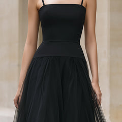 Elegant black tiered tulle maxi dress, flowing and stylish, perfect for formal occasions or evening events.