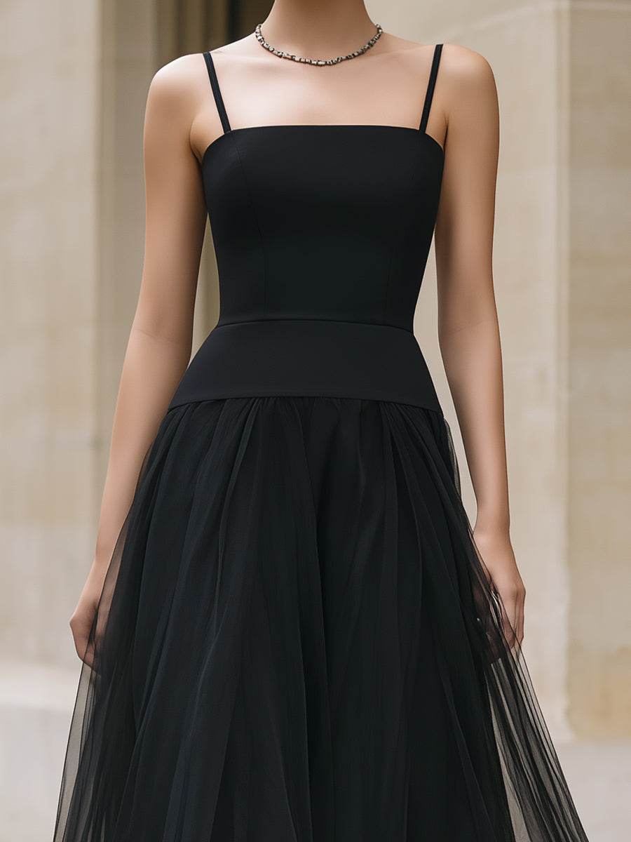 Elegant black tiered tulle maxi dress, flowing and stylish, perfect for formal occasions or evening events.