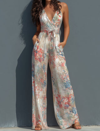 White floral satin halter neck wide-leg jumpsuit for women, featuring a wrap front design and elegant style.