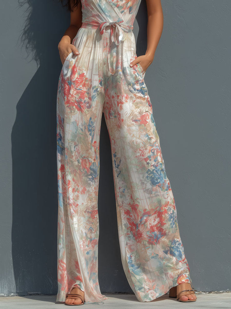 White floral satin halter neck jumpsuit with wrap front and wide-leg pants for women, stylish and elegant.