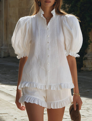 White linen puff sleeve two-piece co-ord set for women featuring high-waisted pants and a matching puff sleeve top.