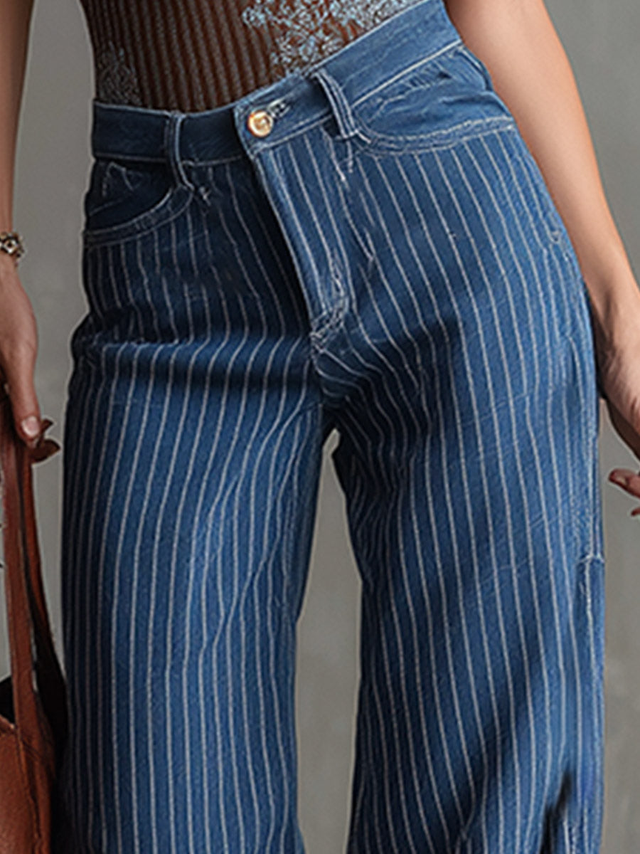 Blue striped straight-leg women's jeans with classic fit, shown on a model, featuring a casual denim style.