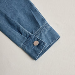 Women’s casual loose denim jumpsuit with long sleeves, hood, zipper, and retro pocket design, perfect for relaxed style.