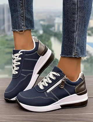 Breathable women's orthopedic sneakers with non-slip soles, designed for comfort and support, featuring a stylish athletic look.