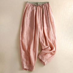 Beige tapered linen trousers for women, loose pull-on pants with a relaxed fit, ideal for casual or stylish wear.