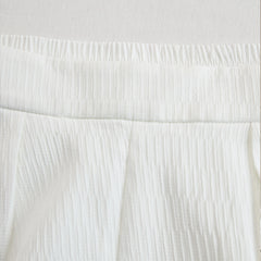 Cream textured lantern sleeve two-piece set for women, featuring stylish pants and a matching top with unique sleeve design.