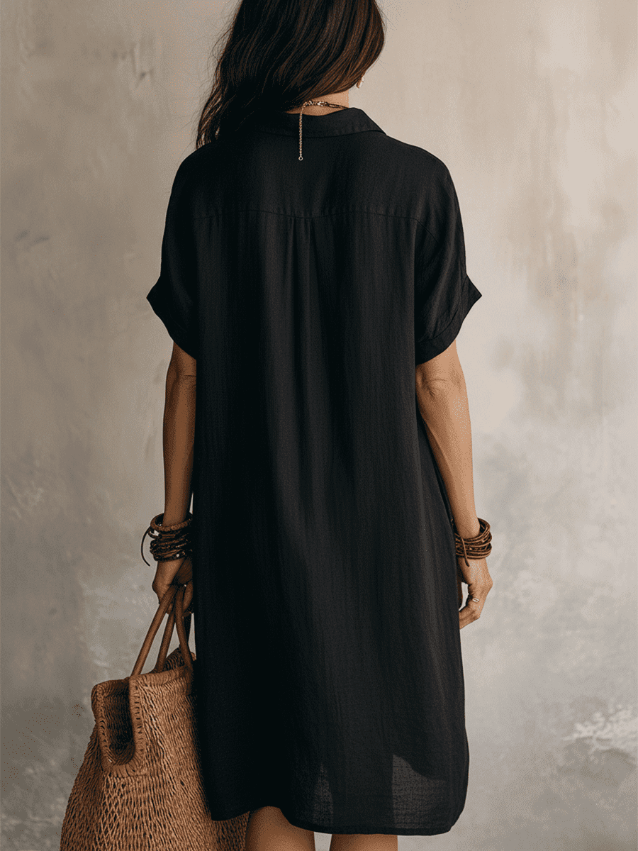 Black linen relaxed midi dress for women by Tammy Bradley, featuring a flowing silhouette and comfortable fit.