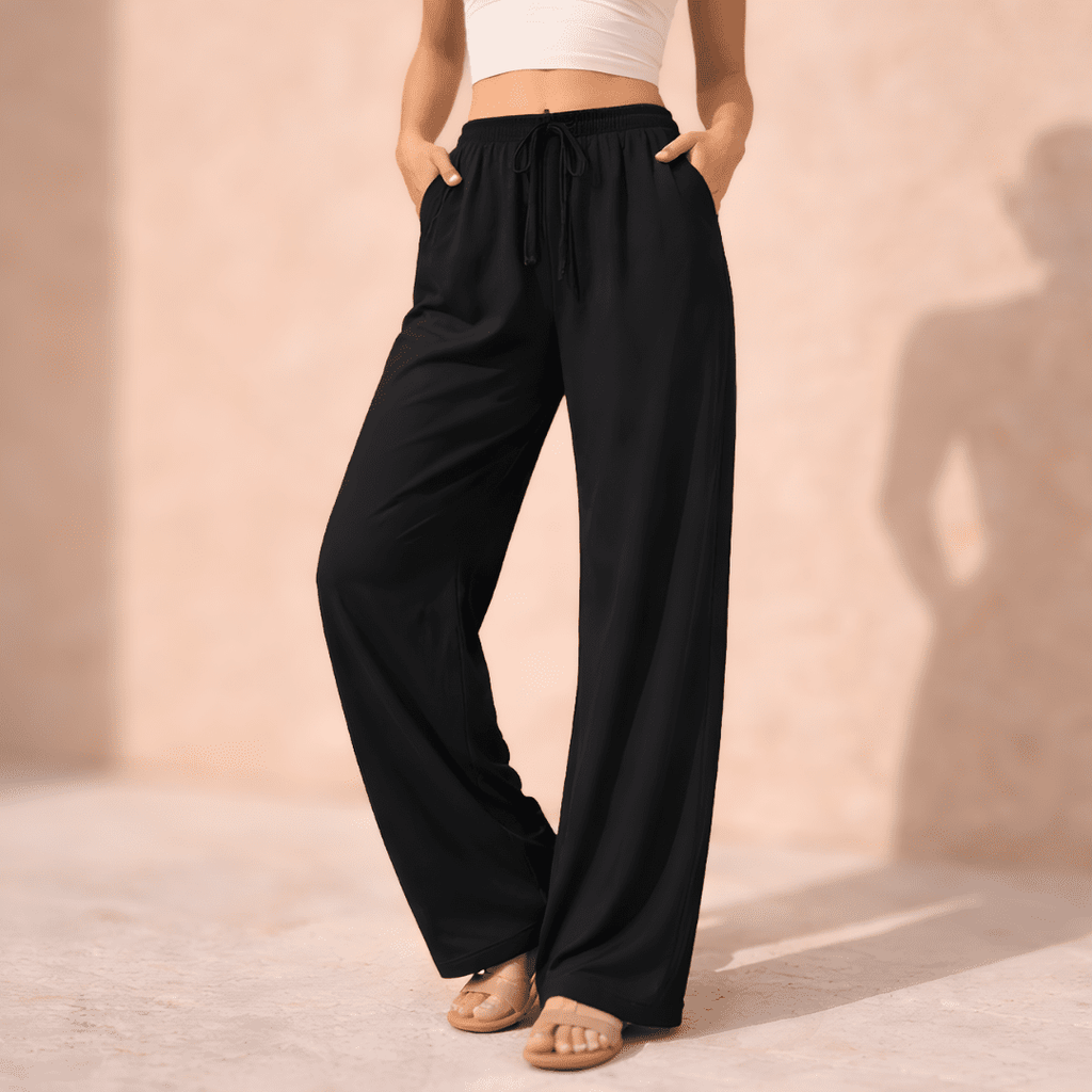 Women's wide-leg drawstring lounge trousers by Tammy Bradley, featuring a relaxed fit and comfortable fabric in the image.
