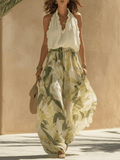 White flowing maxi dress for women by Tammy Bradley, featuring a lightweight, elegant design with a relaxed fit and feminine silhouette.