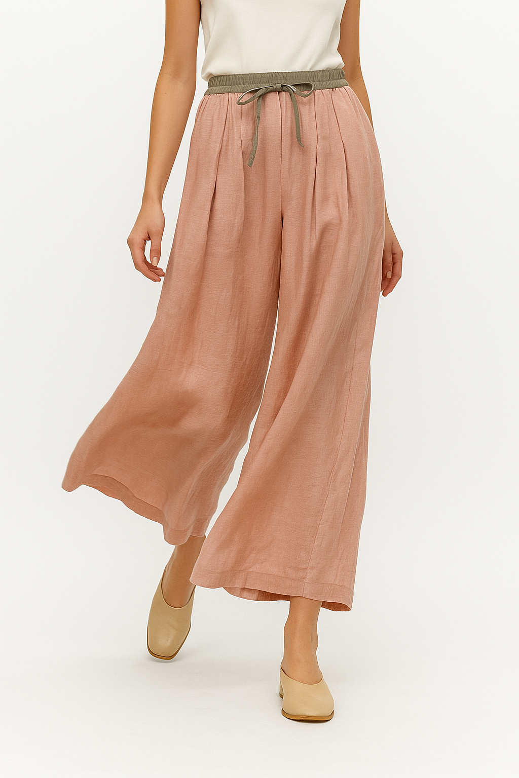 Beige tapered linen trousers for women, loose pull-on pants with a relaxed fit, stylish and comfortable for casual wear.