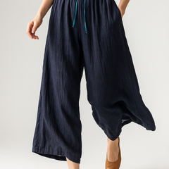 Tapered linen trousers for women from My Store featuring a loose, pull-on design and elegant, lightweight fabric.