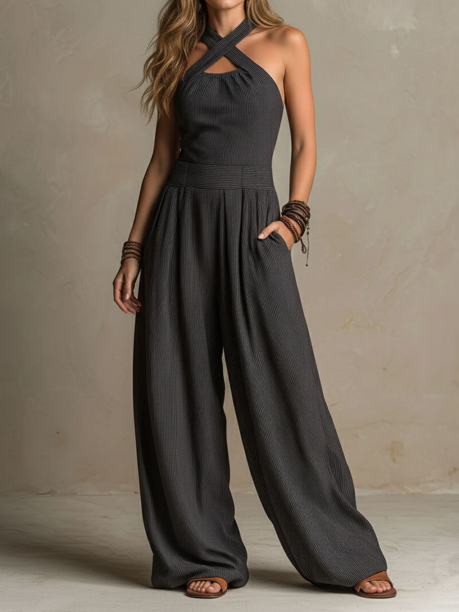 Charcoal pinstripe women's halter neck wide-leg jumpsuit with pants style, featuring a stylish halter top and relaxed fit.