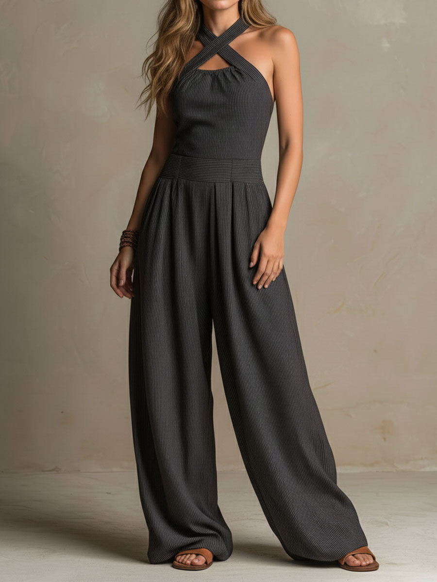 Charcoal pinstripe halter neck wide-leg jumpsuit for women, stylish and comfortable pants, featuring a halter neckline and relaxed fit.