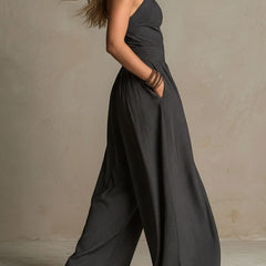 Charcoal pinstripe halter neck wide-leg jumpsuit for women, featuring a stylish halter top and flowing wide-leg pants.