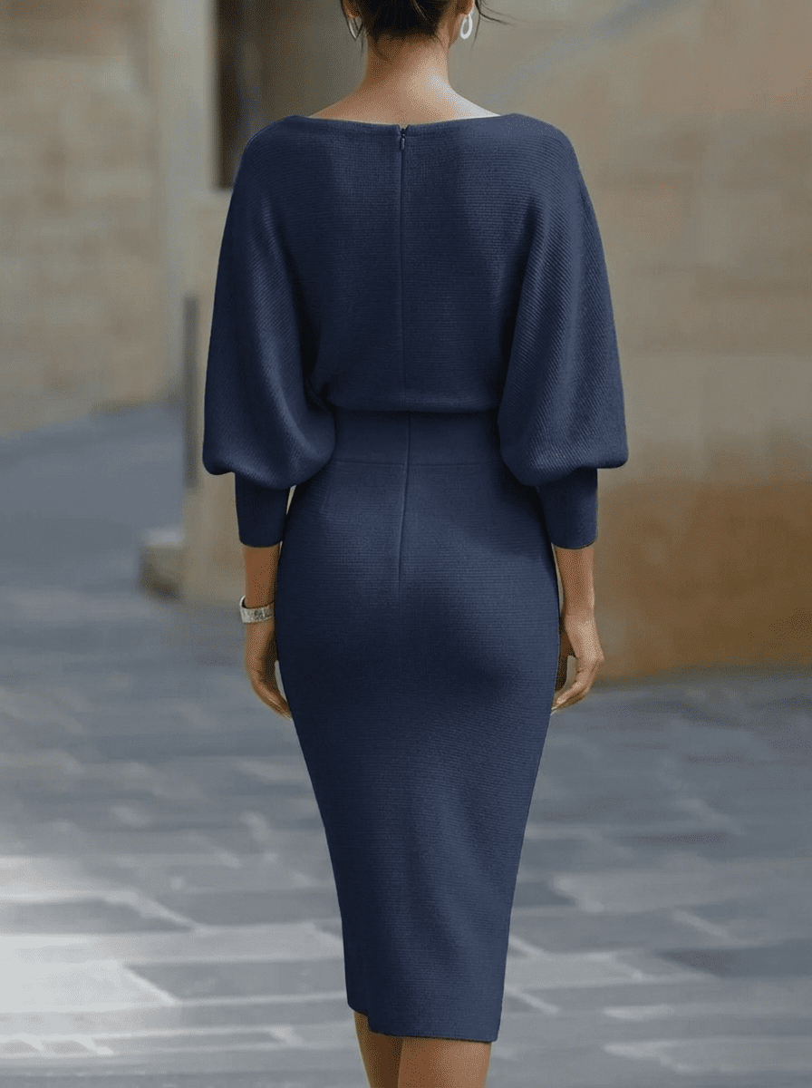 White batwing-sleeve waist-cinching dress for women by Tammy Bradley, showcasing a stylish, flowy design with a fitted waist.